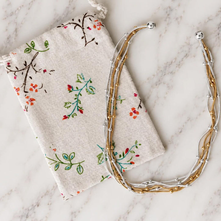 Gold and silver beaded strands of Jess necklace.